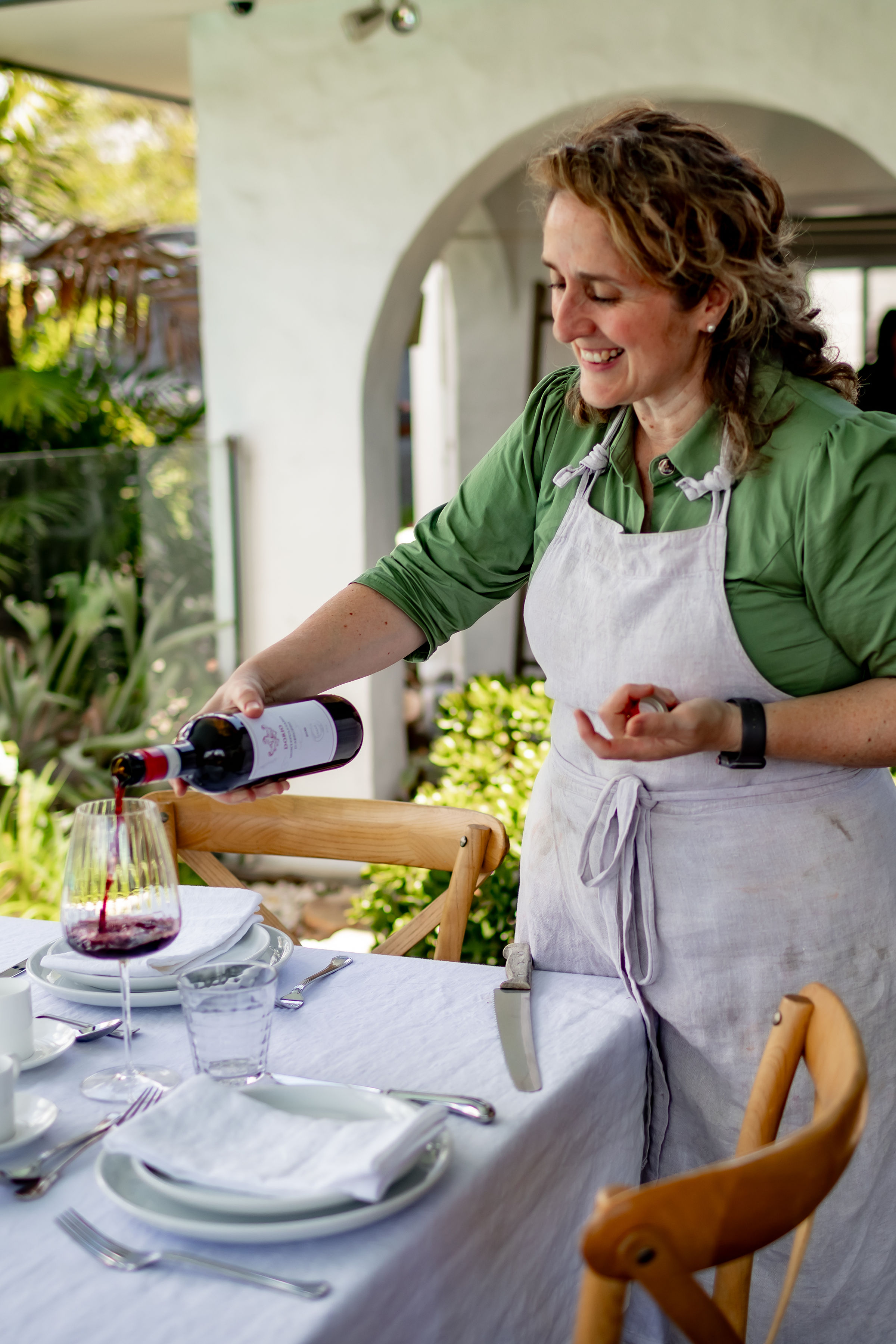 Pouring wine for guests