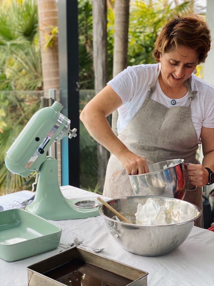 Whisking meringue at the kitchen bench