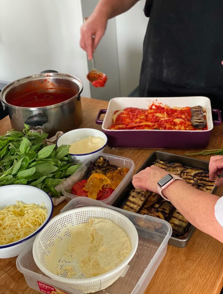 Building a summer lasagna with grilled eggplant, tomato and basil
