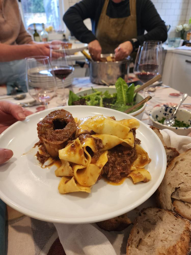 Pappardelle and osso buco at the table