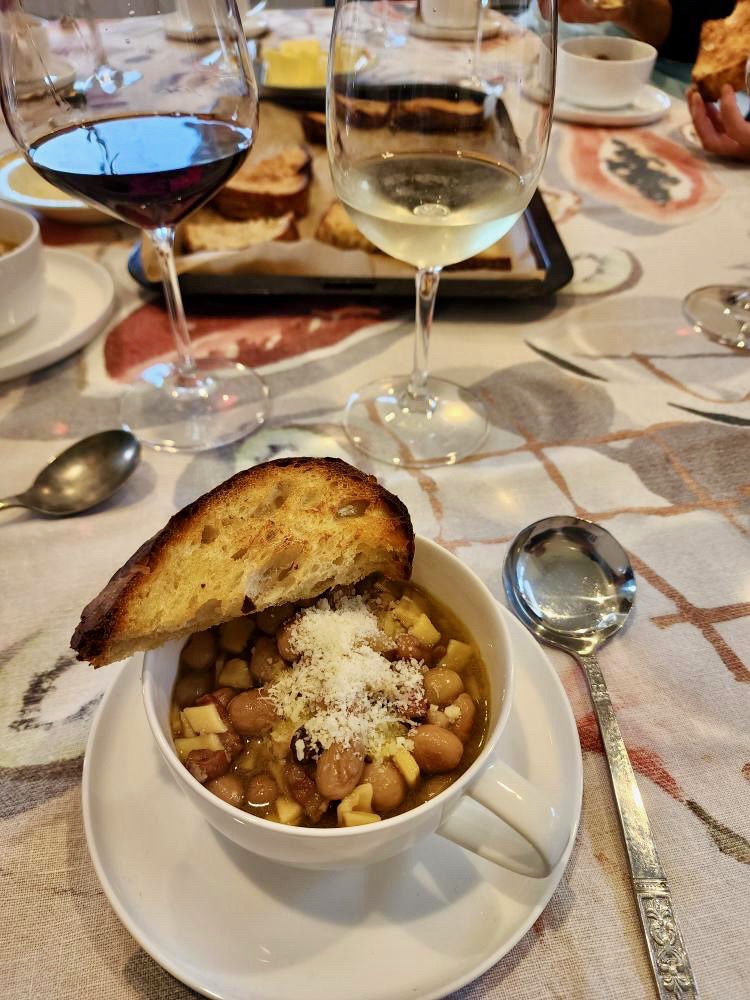 Pasta e fagioli with toasted bread and grated cheese